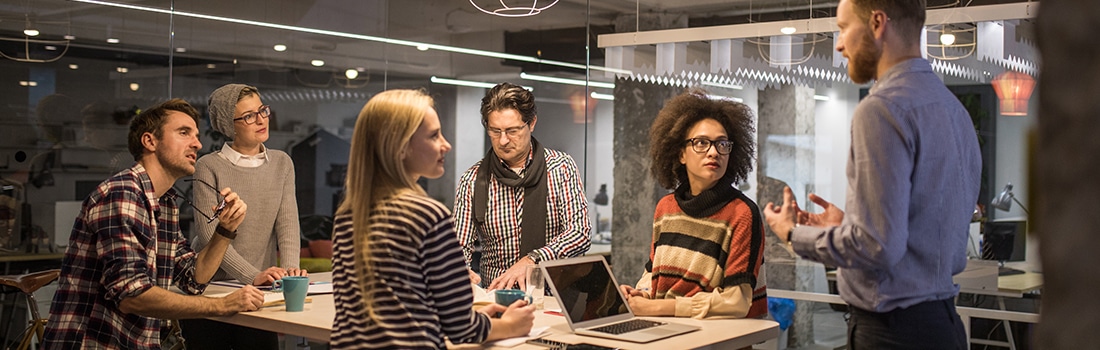 Group of Business IT Support Professionals In Informal Meeting